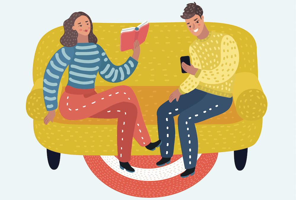 woman and man reading on the couch